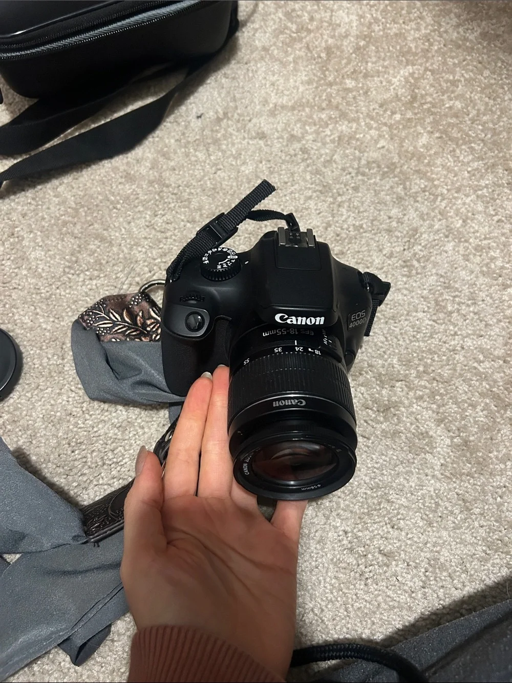 Canon EOS Rebel T1000 - DSLR Camera with Case and Decorative Strap